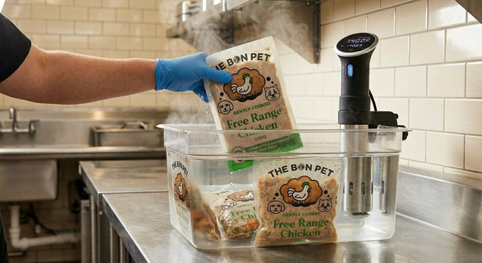The Bon Pet meal pouches being cooked sous vide in a stainless steel kitchen